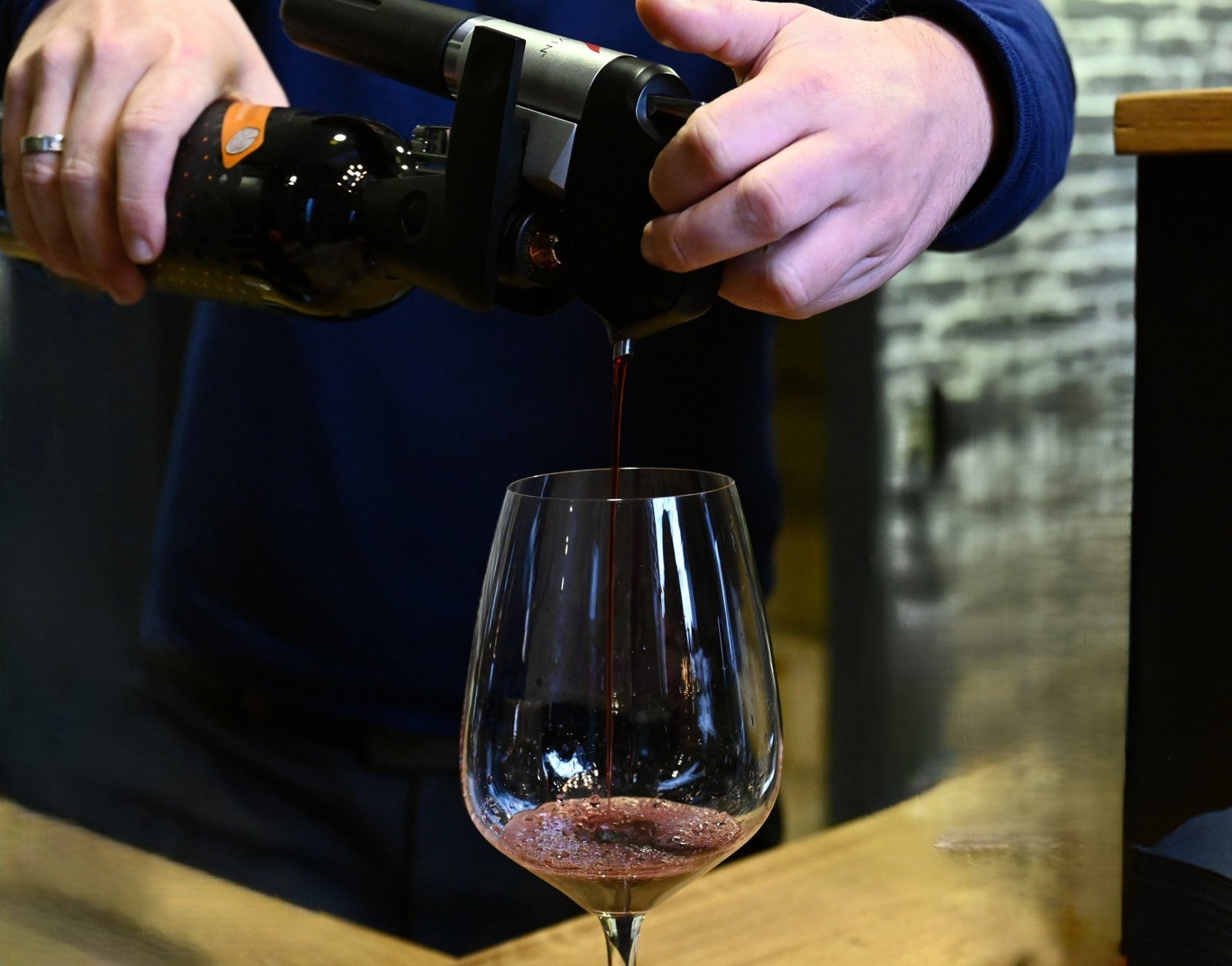 Pouring red wine into a glass